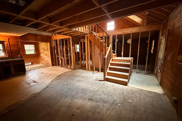9416 Juniper Dr, Tobyhanna, PA 18466 - below grade area with stairway, wooden walls, and a baseboard radiator