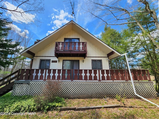 rear view of house with a balcony