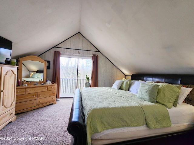 bedroom with access to exterior, carpet, vaulted ceiling, and wood walls