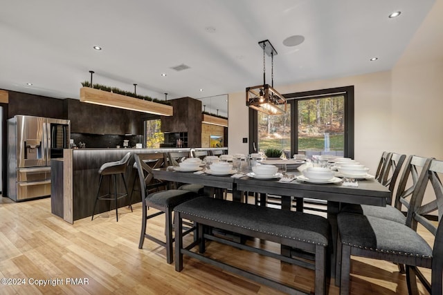 dining area with recessed lighting, visible vents, and light wood-style flooring