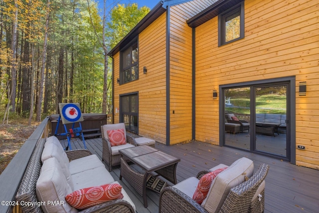 wooden deck featuring an outdoor hangout area