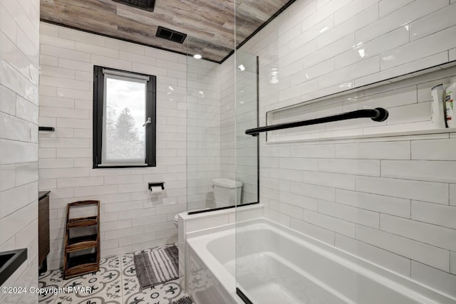 bathroom with tile walls and tile patterned floors