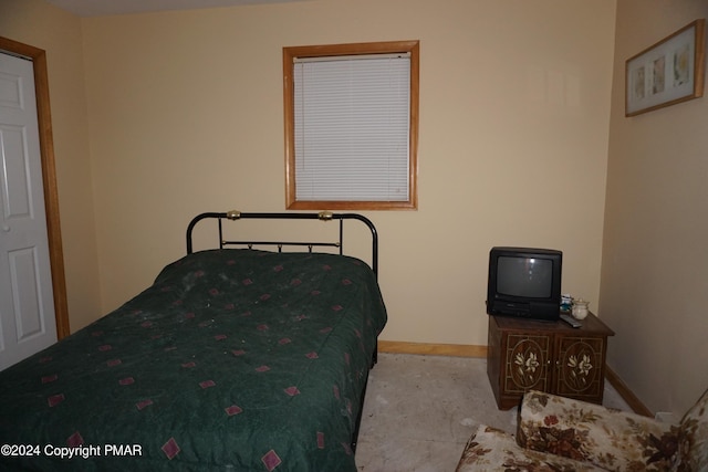 bedroom featuring baseboards