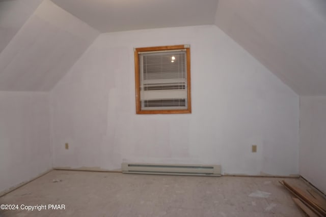 bonus room with vaulted ceiling and baseboard heating