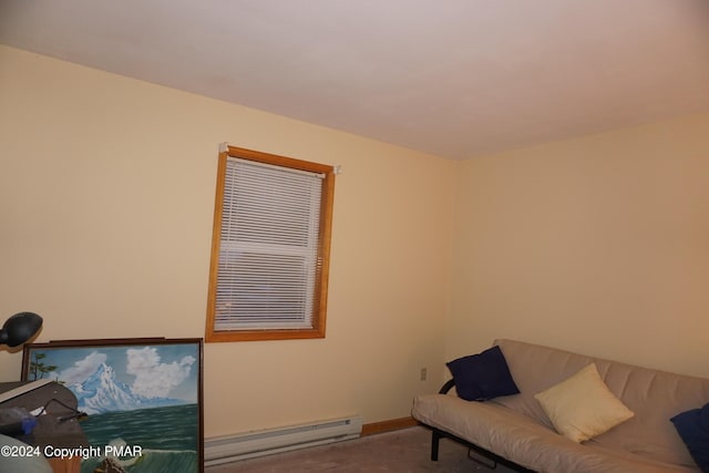 sitting room featuring baseboard heating, carpet flooring, and baseboards