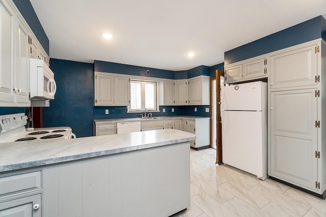 312 Columbia Ave, Palmerton, PA 18071 - kitchen with white appliances, a peninsula, light marble finish floors, and recessed lighting