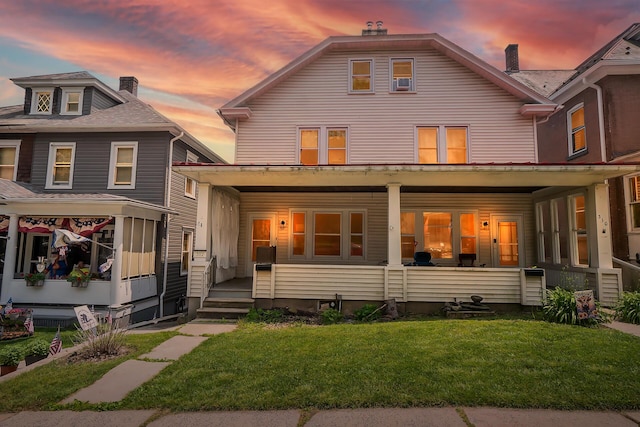312 Columbia Ave, Palmerton, PA 18071 - view of front facade featuring covered porch and a front yard