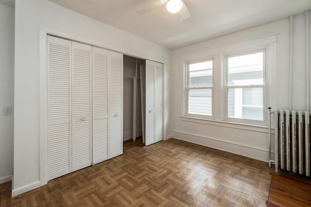 312 Columbia Ave, Palmerton, PA 18071 - unfurnished bedroom featuring radiator, a closet, and a ceiling fan
