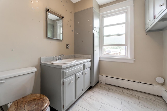 312 Columbia Ave, Palmerton, PA 18071 - bathroom with a baseboard radiator, vanity, and marble look tiles