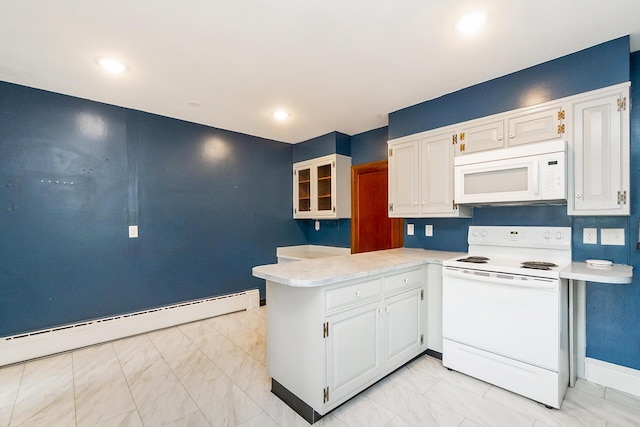 312 Columbia Ave, Palmerton, PA 18071 - kitchen with white appliances, light countertops, white cabinets, and a peninsula