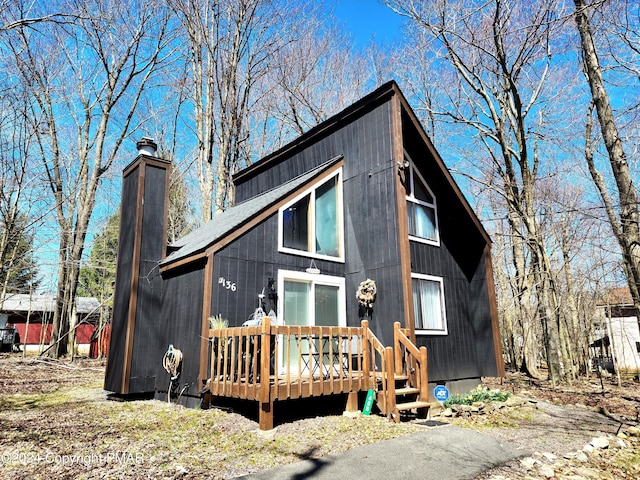 exterior space featuring a wooden deck