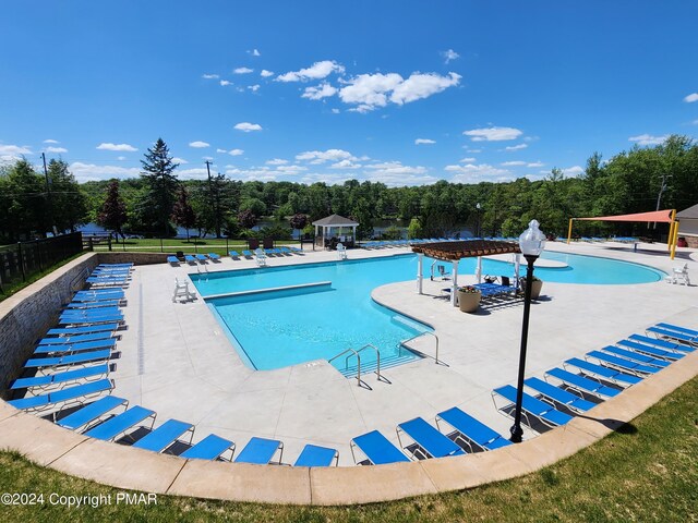 view of swimming pool with a gazebo, a pergola, and a patio area