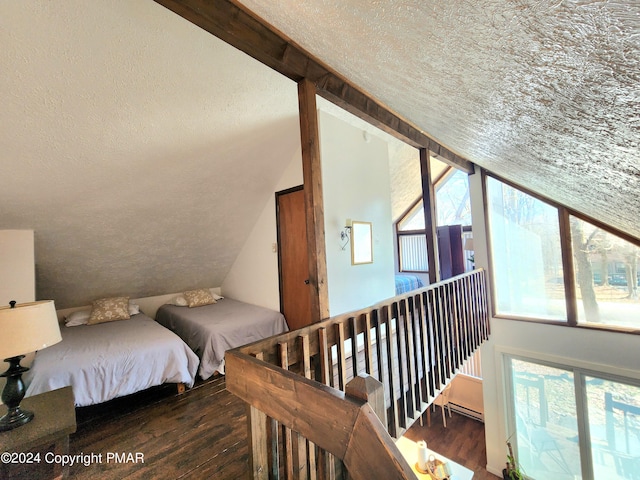488 Country Place Dr, Tobyhanna, PA 18466 - bedroom featuring lofted ceiling with beams, a textured ceiling, and wood finished floors