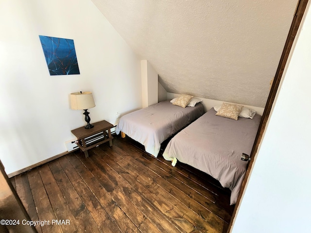 488 Country Place Dr, Tobyhanna, PA 18466 - bedroom featuring baseboards, a textured ceiling, dark wood finished floors, and vaulted ceiling