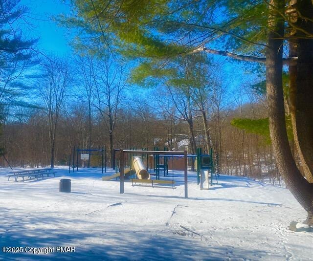 view of property's community with a playground