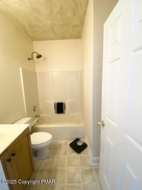 full bathroom featuring toilet, vanity, and shower / washtub combination