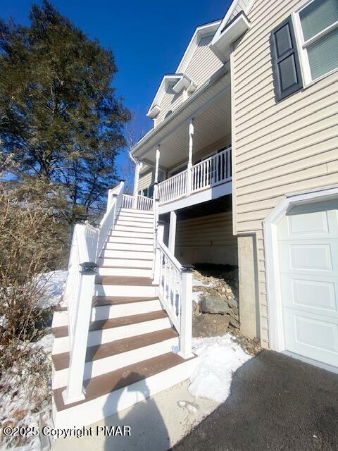 view of side of property with a garage