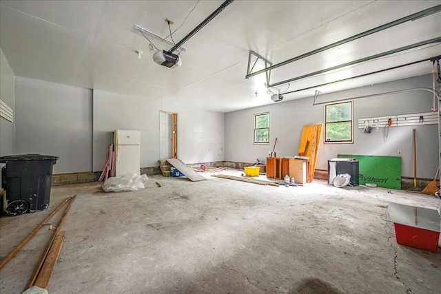 188 Cress Dr, Saylorsburg, PA 18353 - garage featuring a garage door opener and freestanding refrigerator