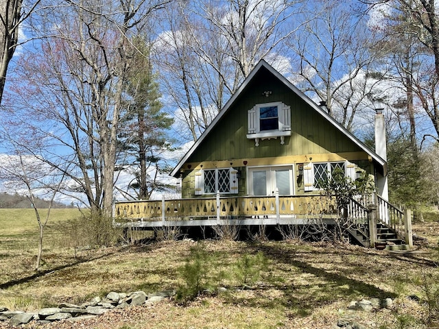 215 Outer Dr, Dingmans Ferry, PA 18328 - view of front of house featuring a wooden deck and a chimney