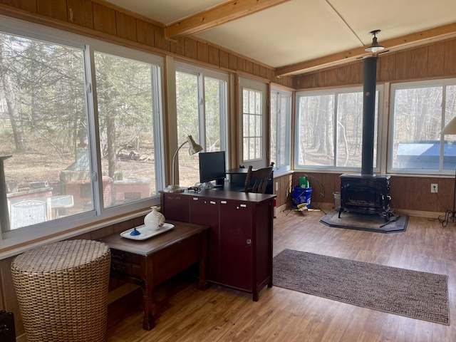215 Outer Dr, Dingmans Ferry, PA 18328 - sunroom featuring wooden walls, beam ceiling, a wood stove, and wood finished floors