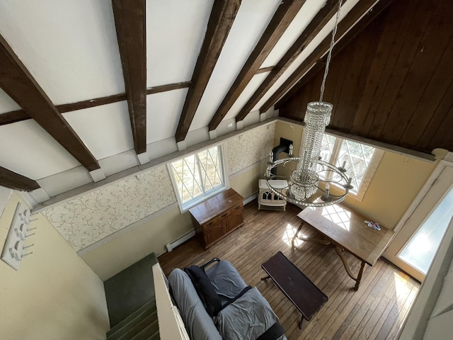215 Outer Dr, Dingmans Ferry, PA 18328 - living room with a notable chandelier, a baseboard heating unit, wallpapered walls, beamed ceiling, and hardwood / wood-style floors