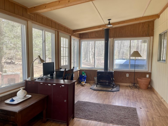 215 Outer Dr, Dingmans Ferry, PA 18328 - sunroom with wooden walls, a wood stove, wood finished floors, and a healthy amount of sunlight