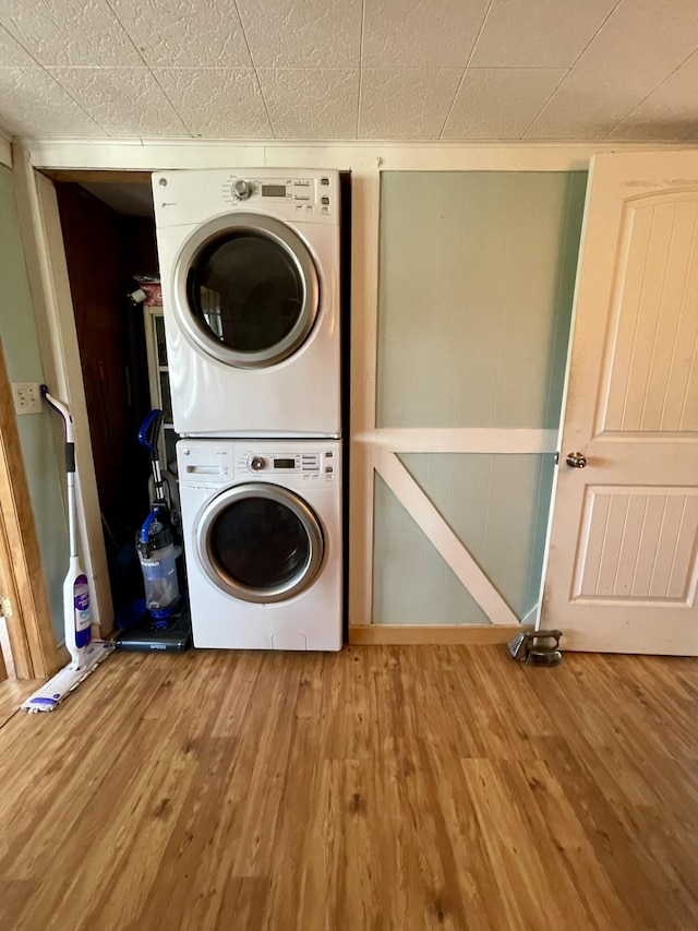 215 Outer Dr, Dingmans Ferry, PA 18328 - laundry room featuring laundry area, stacked washer and dryer, and wood finished floors