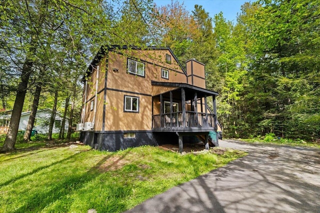 483 Alter Ave, Pocono Summit, PA 18346 - view of front of property with a front lawn and a wooden deck