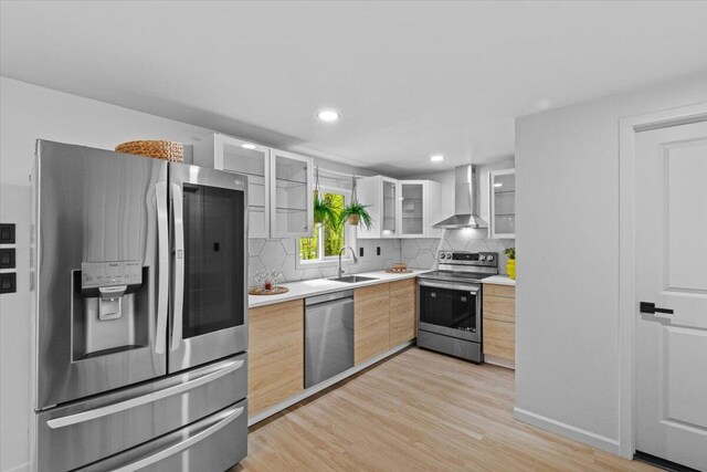 483 Alter Ave, Pocono Summit, PA 18346 - kitchen with appliances with stainless steel finishes, wall chimney exhaust hood, a sink, light countertops, and light brown cabinetry
