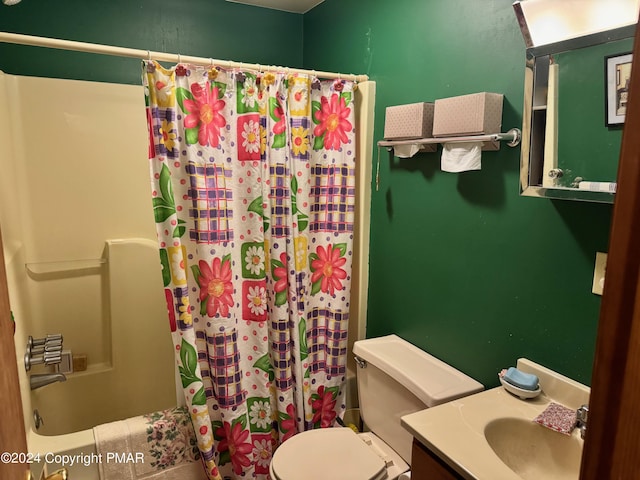 full bathroom featuring toilet, shower / bath combo, and vanity