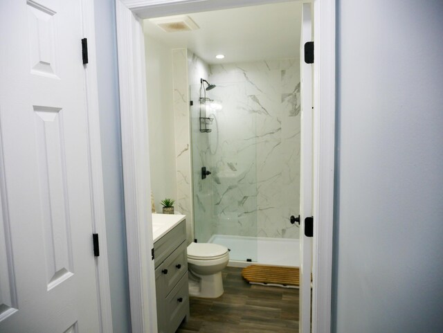 5109 Hickory Ln, East Stroudsburg, PA 18302 - bathroom with toilet, vanity, wood finished floors, and a marble finish shower