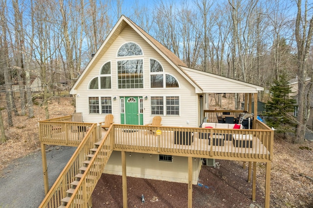 225 N Arrow Dr, Pocono Lake, PA 18347 - rear view of house with a wooden deck and stairway
