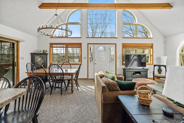 225 N Arrow Dr, Pocono Lake, PA 18347 - carpeted living room featuring plenty of natural light, high vaulted ceiling, beam ceiling, and a chandelier