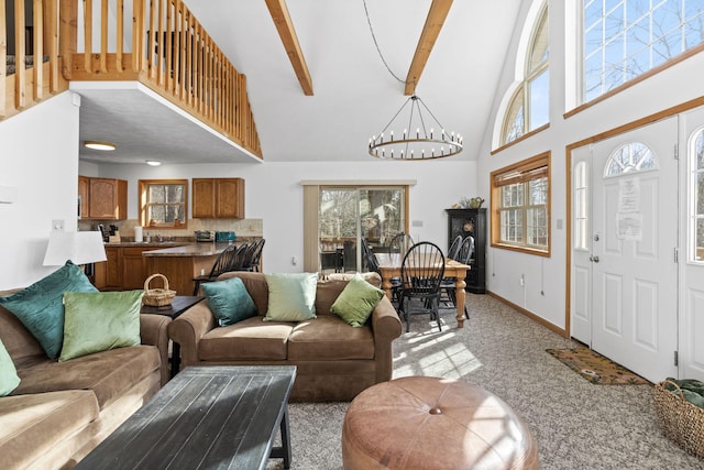 225 N Arrow Dr, Pocono Lake, PA 18347 - living room featuring a chandelier, high vaulted ceiling, light colored carpet, and beam ceiling