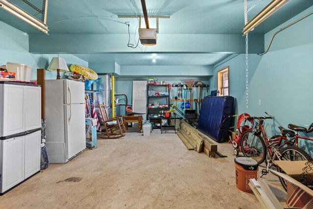 225 N Arrow Dr, Pocono Lake, PA 18347 - garage with freestanding refrigerator and a garage door opener