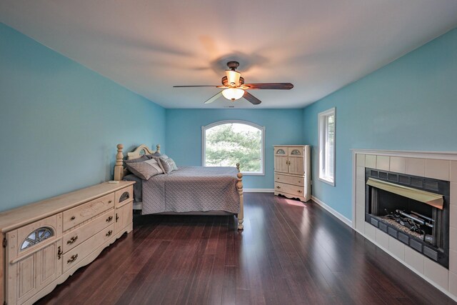 205 Osprey Way E, Stroudsburg, PA 18302 - bedroom featuring a tiled fireplace, dark wood finished floors, baseboards, and ceiling fan
