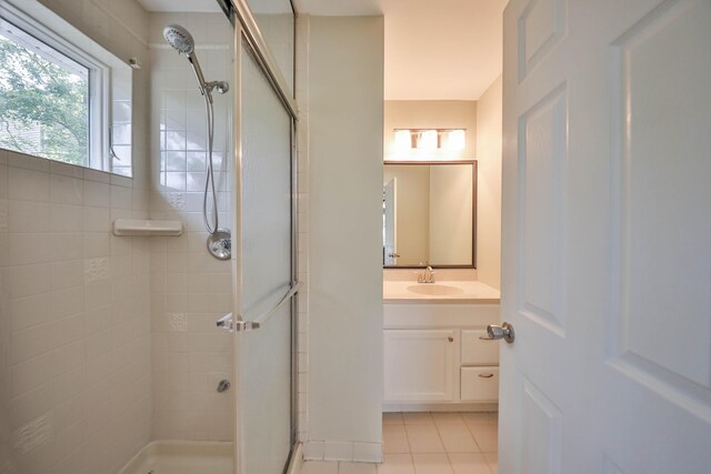 205 Osprey Way E, Stroudsburg, PA 18302 - bathroom featuring a shower stall, vanity, and tile patterned floors