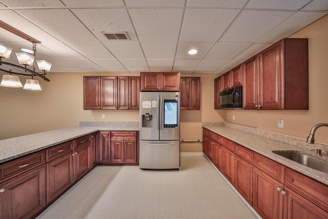 205 Osprey Way E, Stroudsburg, PA 18302 - kitchen with stainless steel fridge, a sink, black microwave, a drop ceiling, and baseboards