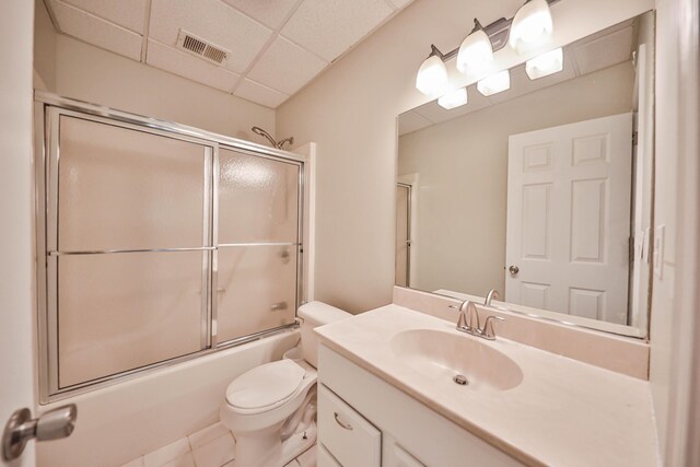 205 Osprey Way E, Stroudsburg, PA 18302 - full bathroom featuring vanity, toilet, bath / shower combo with glass door, a paneled ceiling, and tile patterned flooring