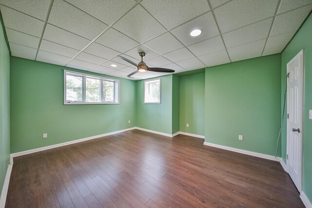 205 Osprey Way E, Stroudsburg, PA 18302 - empty room with a ceiling fan, dark wood-style floors, a paneled ceiling, and baseboards
