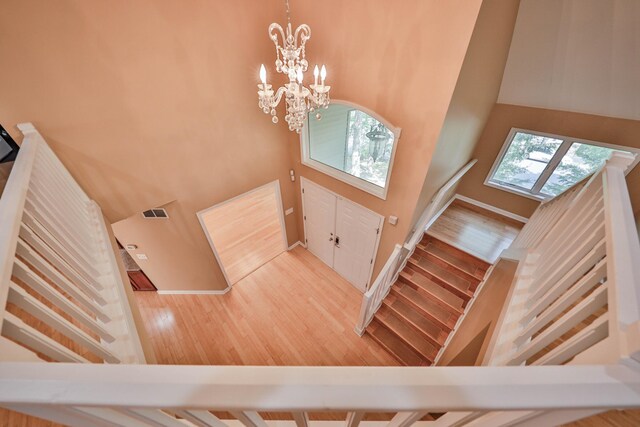 205 Osprey Way E, Stroudsburg, PA 18302 - foyer entrance featuring a high ceiling, wood finished floors, a chandelier, and stairs
