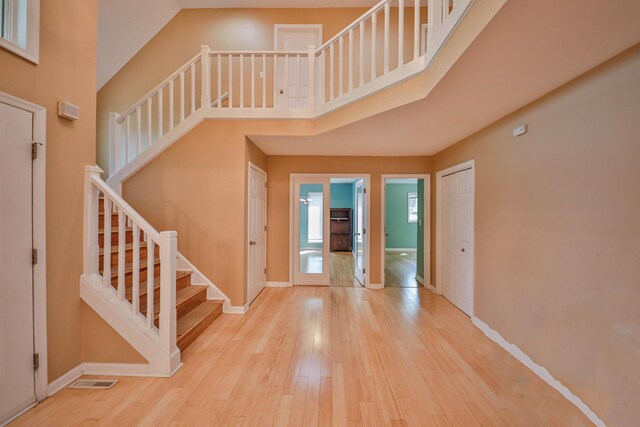 205 Osprey Way E, Stroudsburg, PA 18302 - foyer with stairs, wood finished floors, baseboards, and a high ceiling