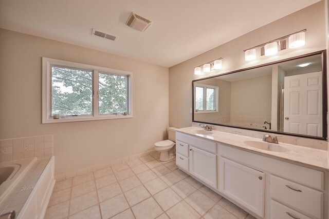 205 Osprey Way E, Stroudsburg, PA 18302 - bathroom with double vanity, plenty of natural light, a tub to relax in, and baseboards