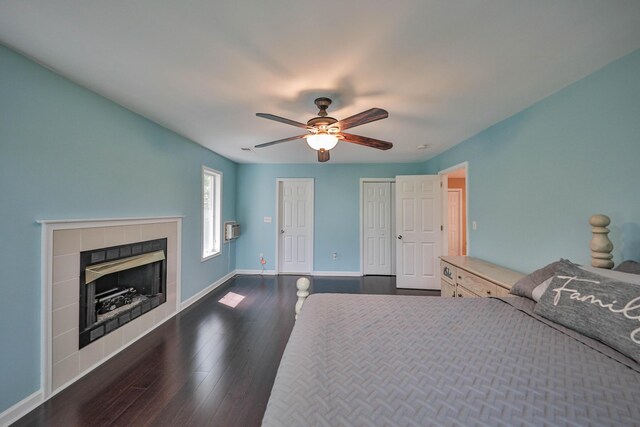 205 Osprey Way E, Stroudsburg, PA 18302 - bedroom with wood finished floors, baseboards, a tile fireplace, ceiling fan, and a wall mounted AC