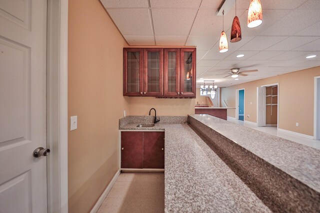 205 Osprey Way E, Stroudsburg, PA 18302 - bar area with a paneled ceiling, a sink, baseboards, a chandelier, and decorative light fixtures
