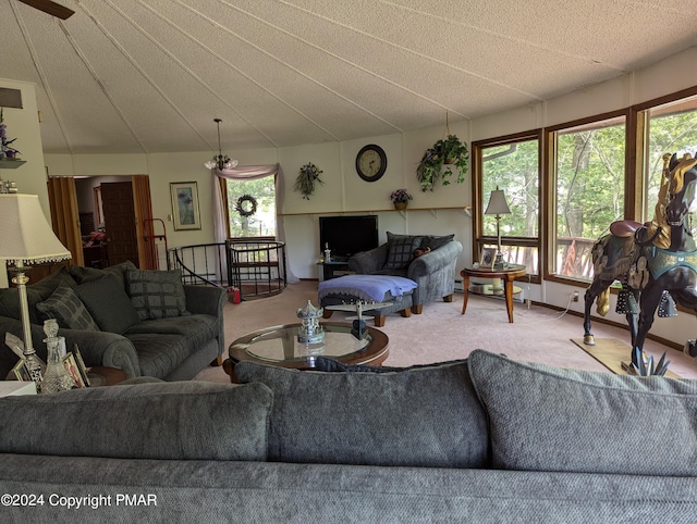 carpeted living area with lofted ceiling