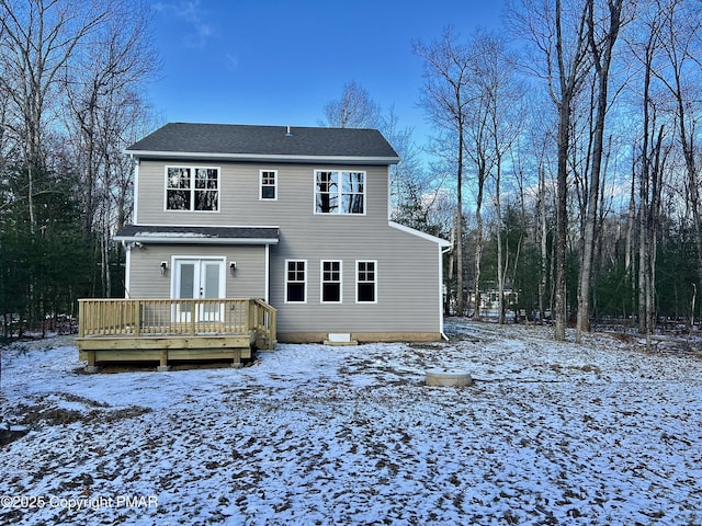 exterior space with a deck and french doors