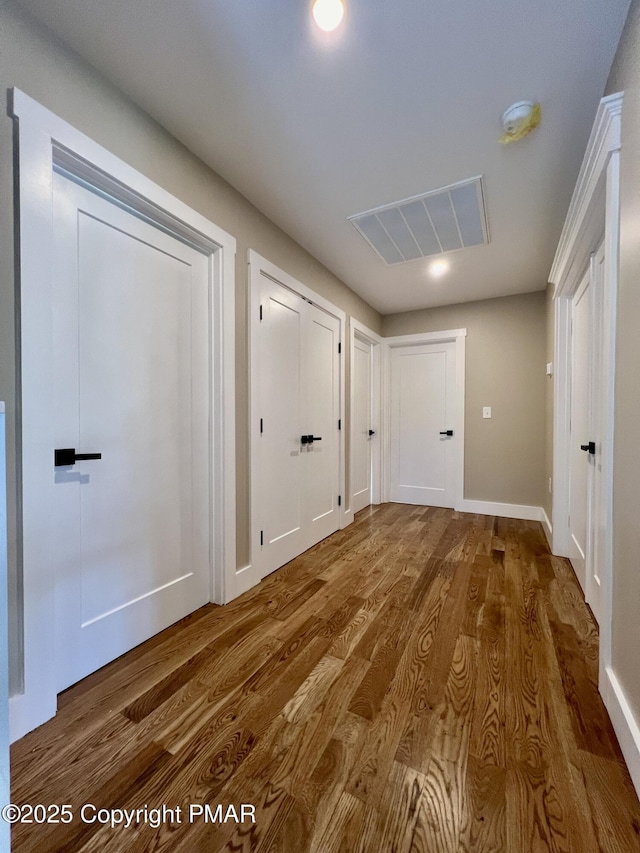 doorway to outside featuring visible vents and wood finished floors