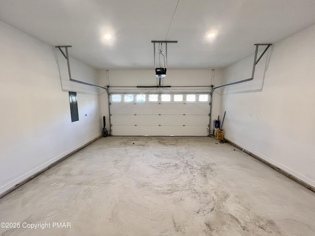 garage with a garage door opener, electric panel, and baseboards