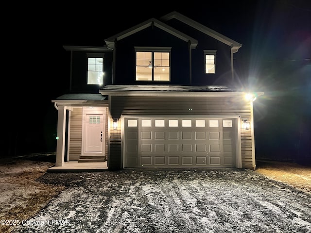 view of front facade featuring driveway and a garage